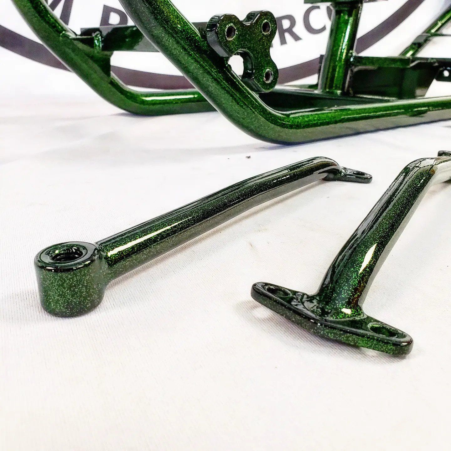 Green Painted Motorcycle Parts — Fort Wayne, IN — ProStrip Professional Metal Refinishing, Inc.
