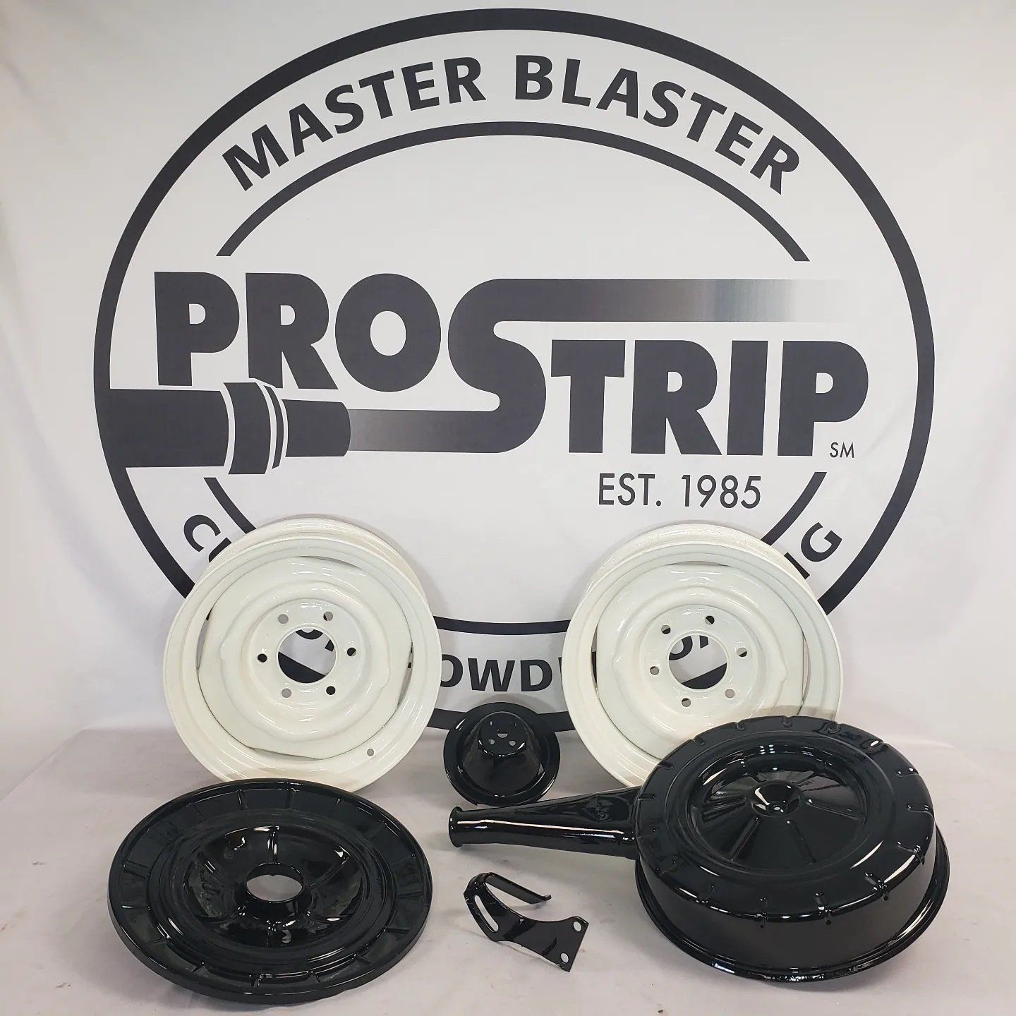 A close up of a white steel wheel