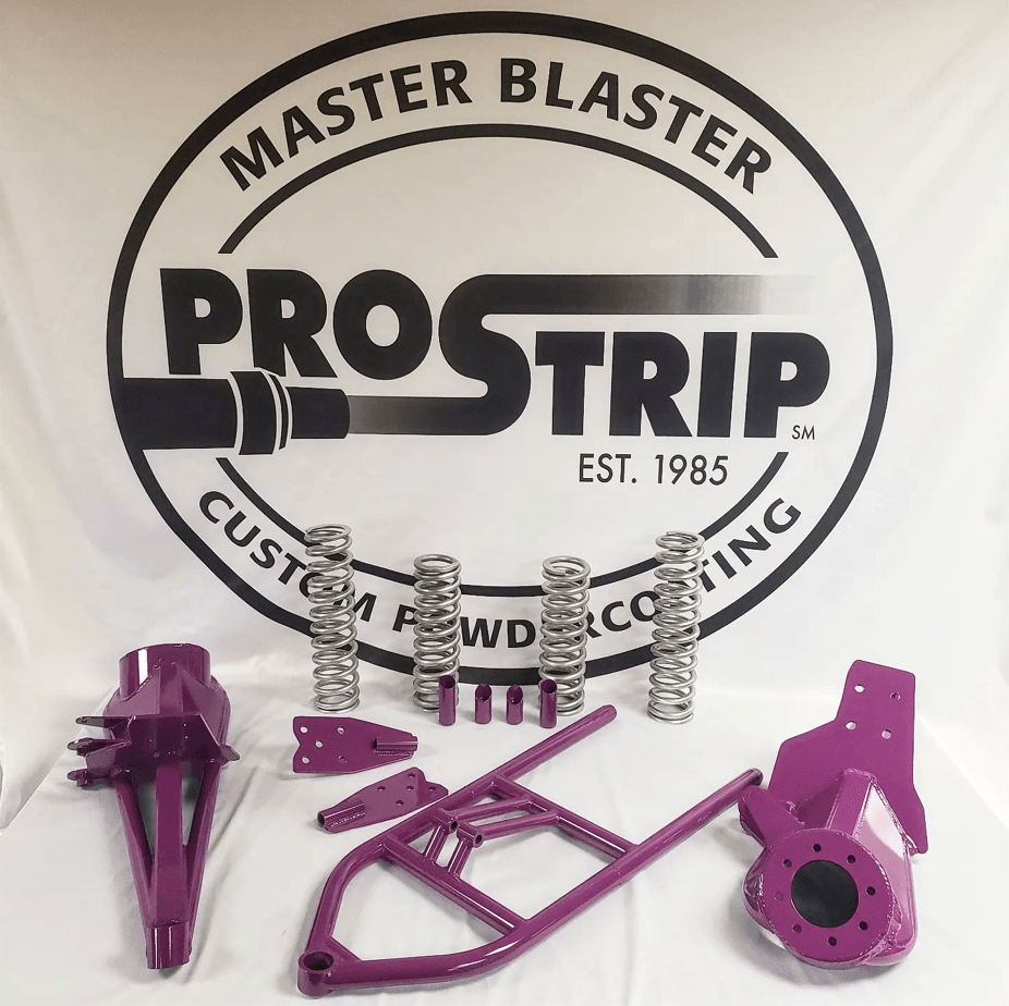 Purple parts are sitting in front of a master blaster logo