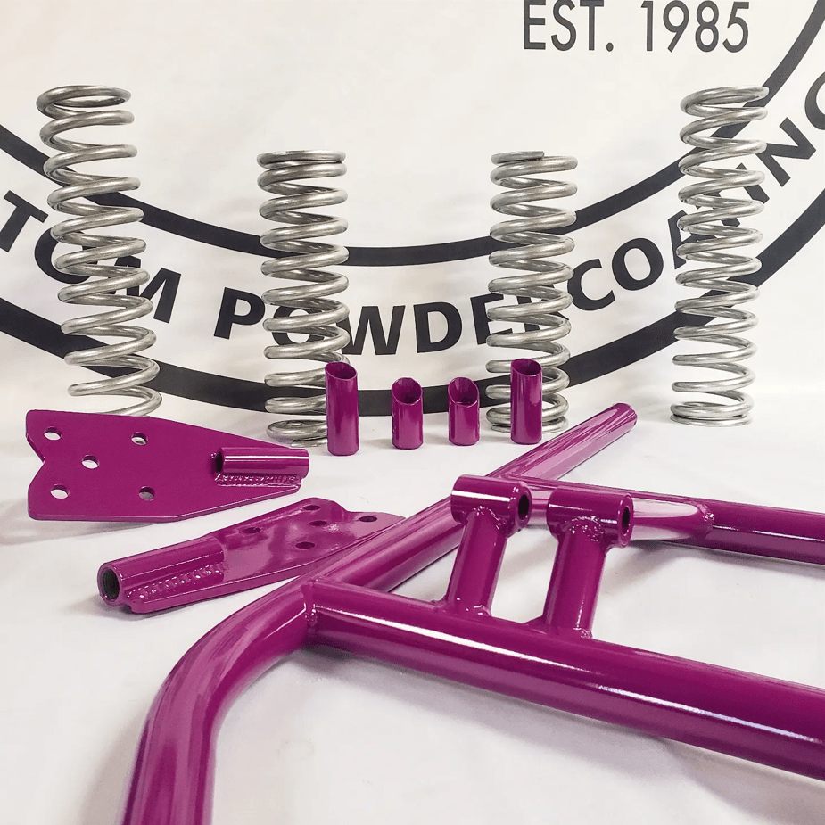 A purple frame with springs and a logo that says est 1985