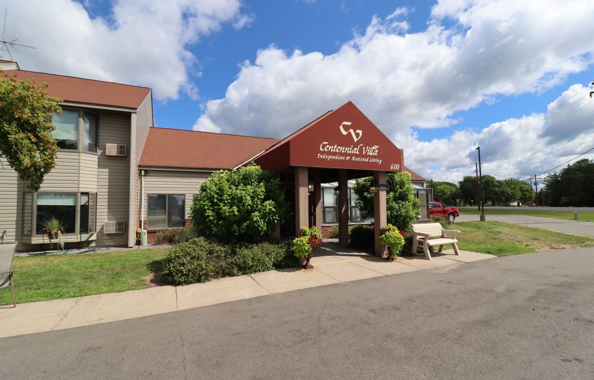A building with a red awning that says gp on it A building with a red awning that says gp on it