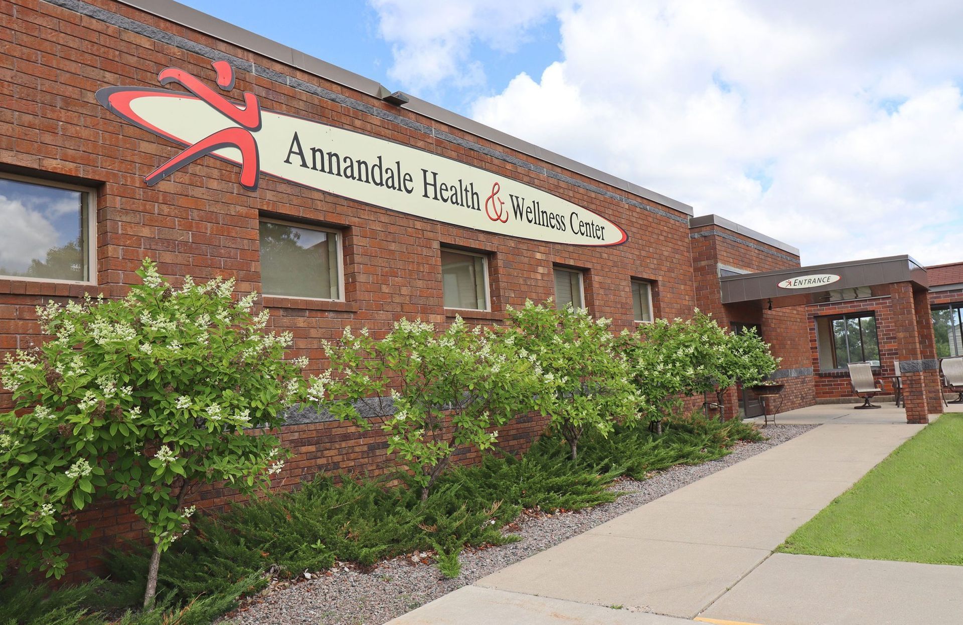 A brick building with a sign that says ' annandale health & wellness care ' on it A brick building with a sign that says ' annandale health & wellness care ' on it