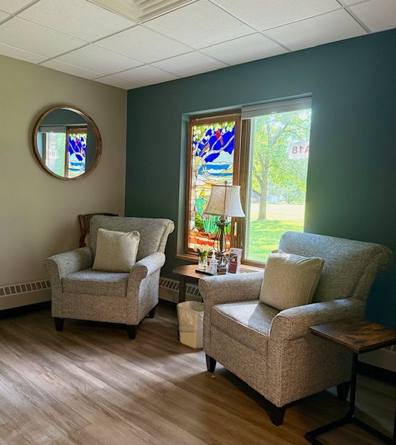 A room with a table and chairs in it