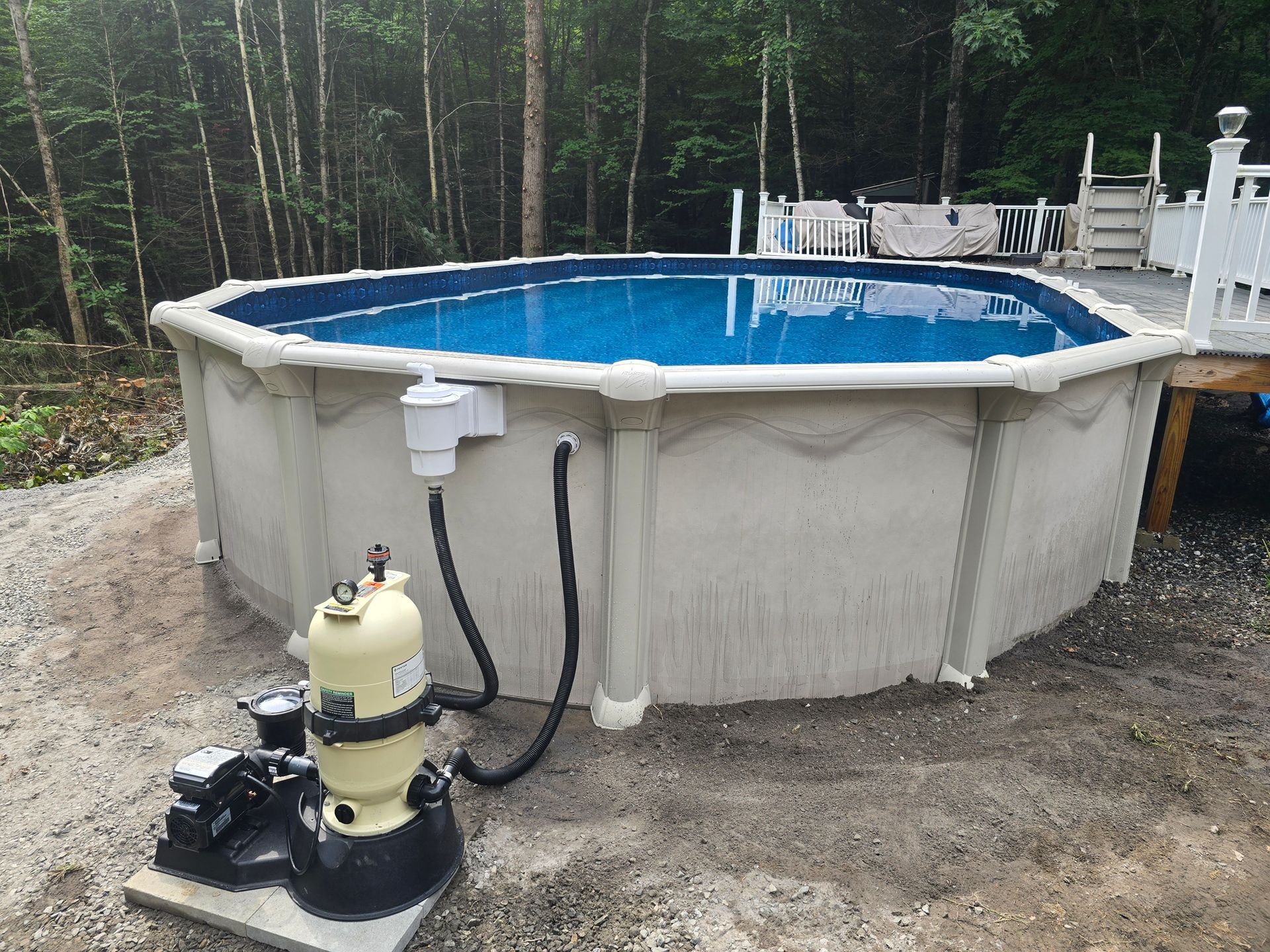 A large swimming pool with a filter attached to it.