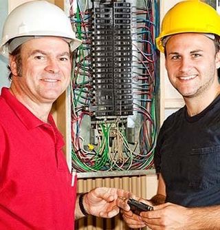 Two Electrician with Electric Panel — Electrician in Sebastian, FL