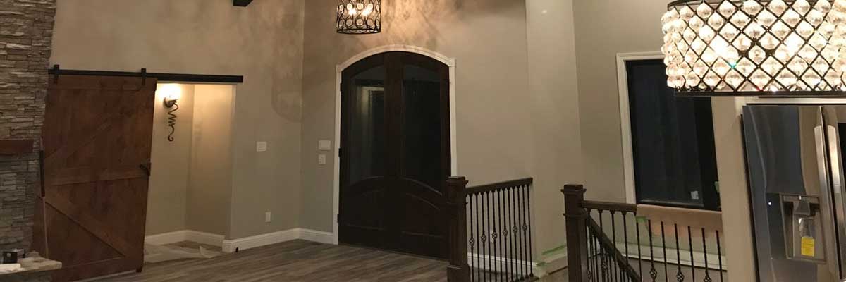 Custom Design Homes - Stairs and wooden door in Marion, IL