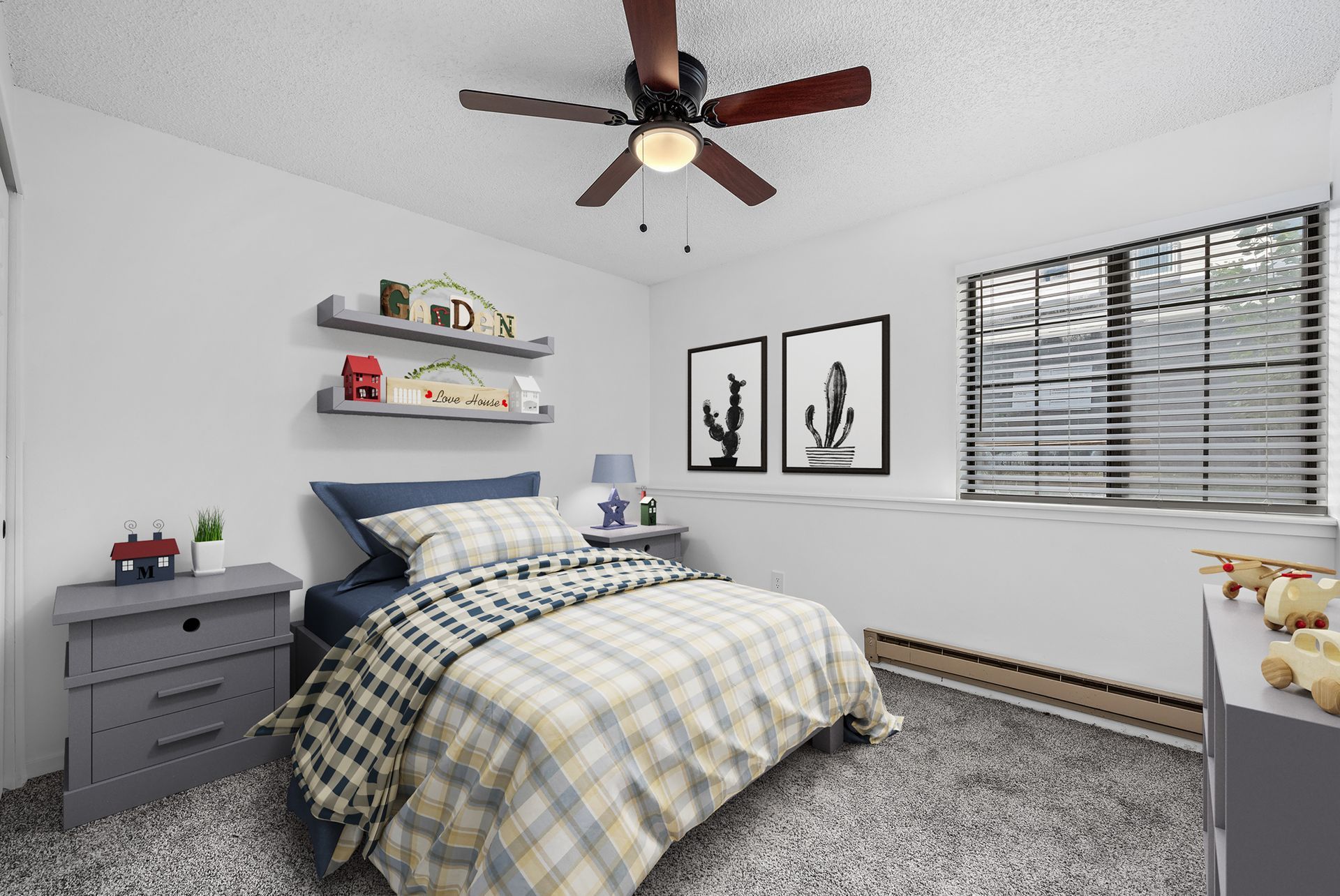 PHoto showing a large bedroom with carpet
