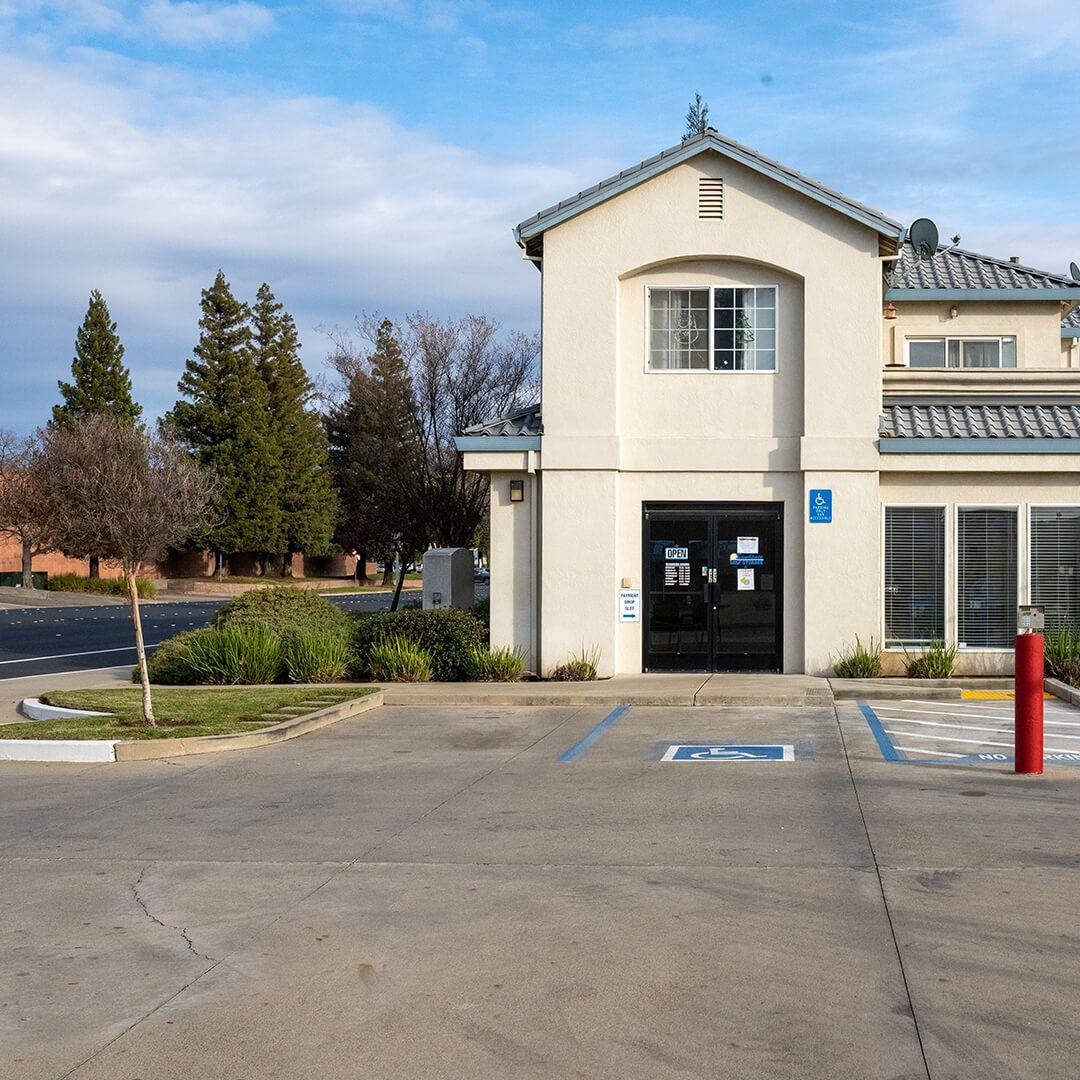 a building with a handicapped parking spot in front of it