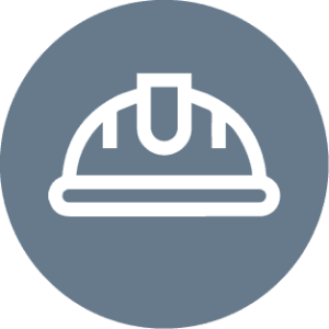There is an icon of a white hard hat in a gray circle.