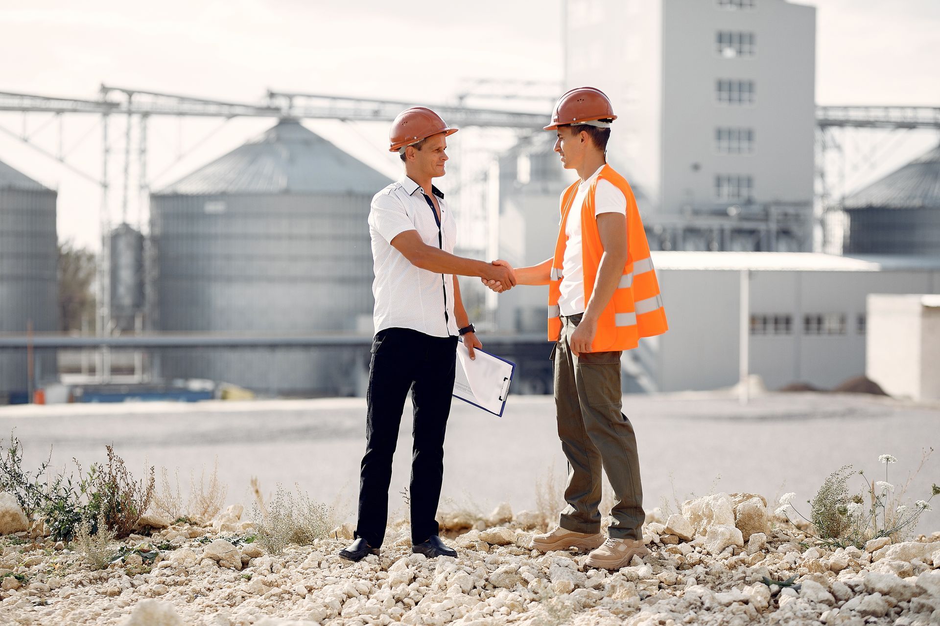 two men in construction hates meeting on a work site