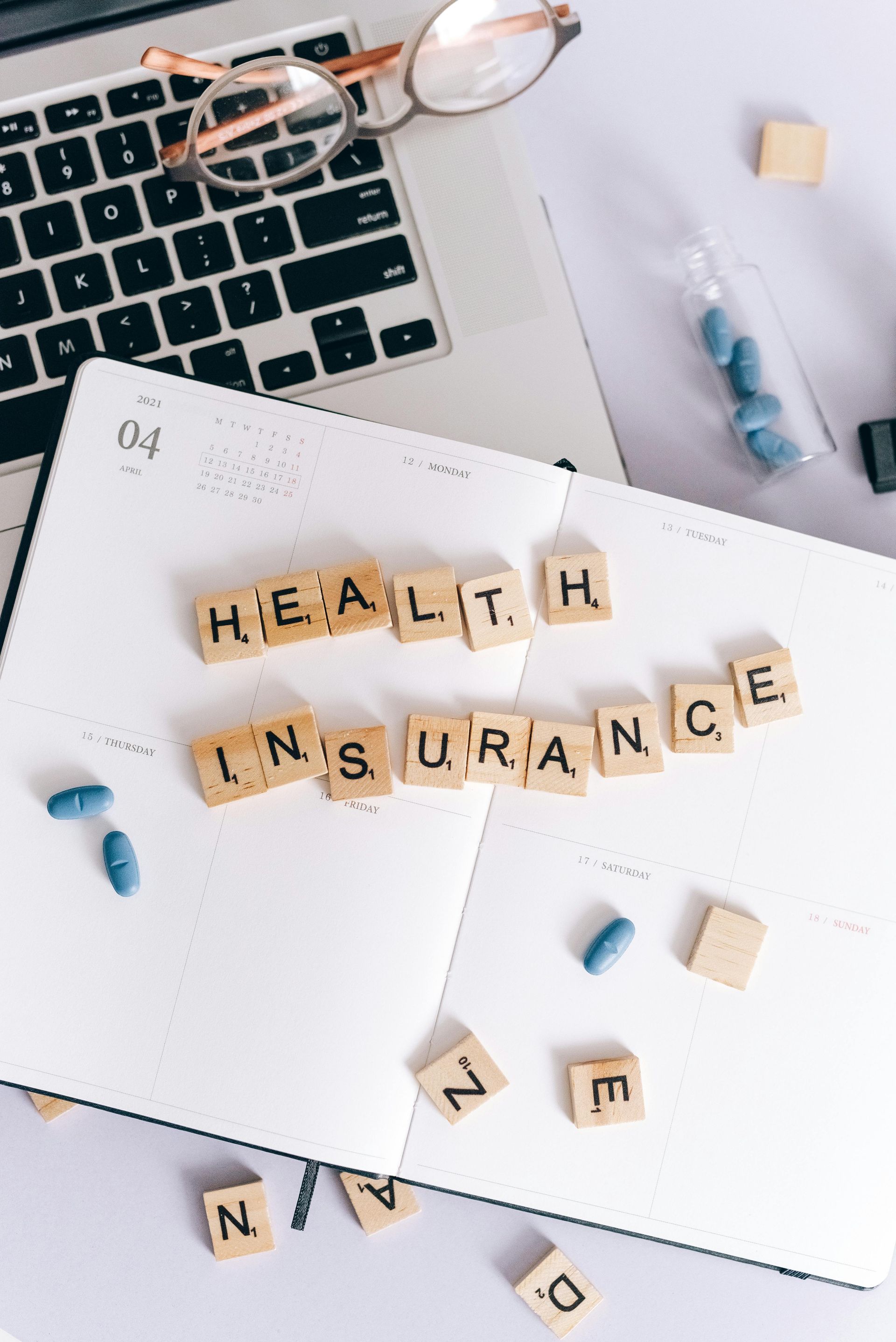 Health insurance spelled out with word game pieces