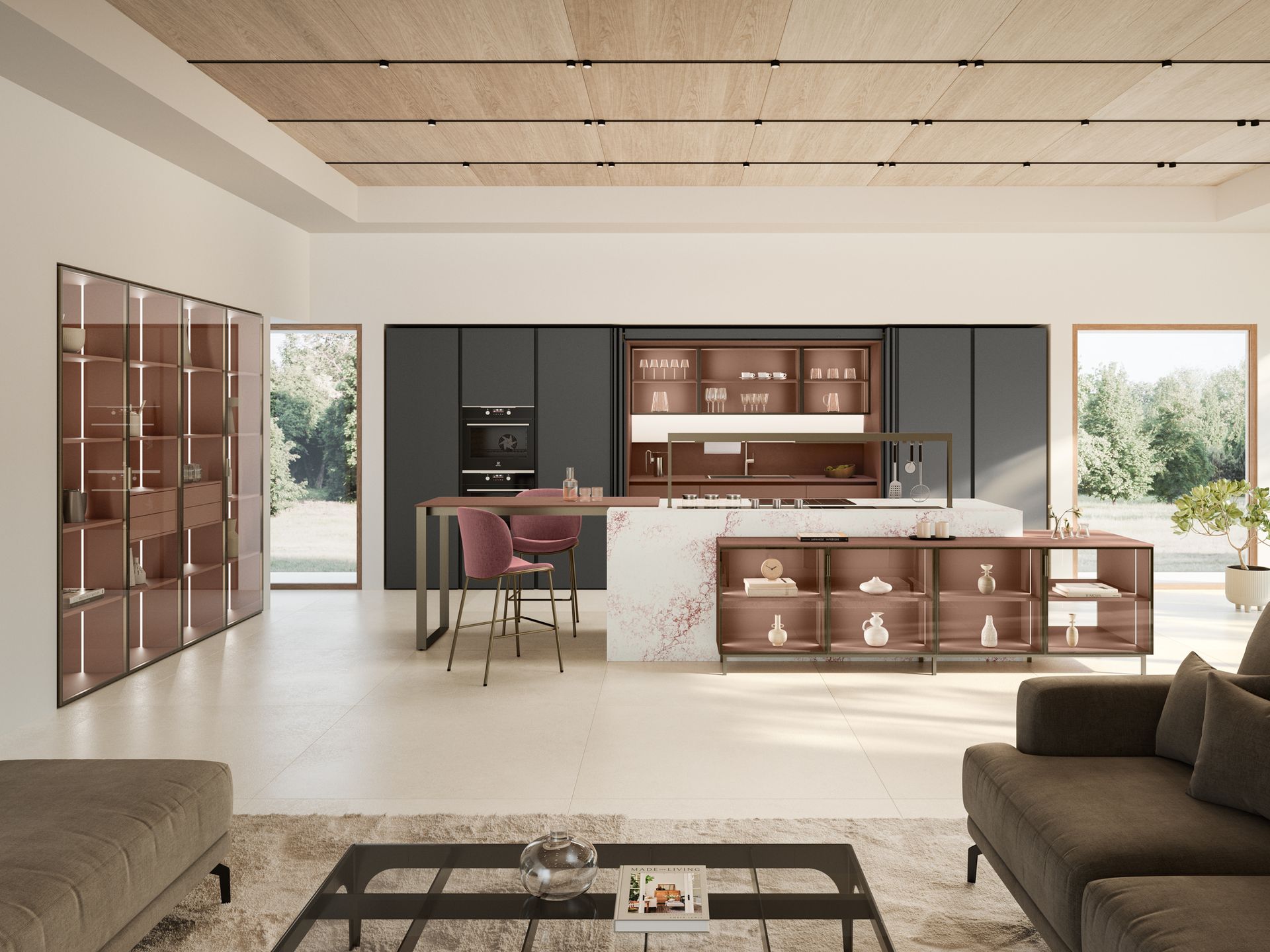 Cucina moderna con mobili marroni, paraschizzi grigio scuro, isola bianca e zona salotto.