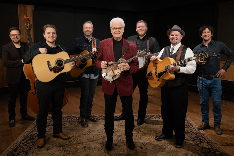 Group of people posing for a promotional photo for the 