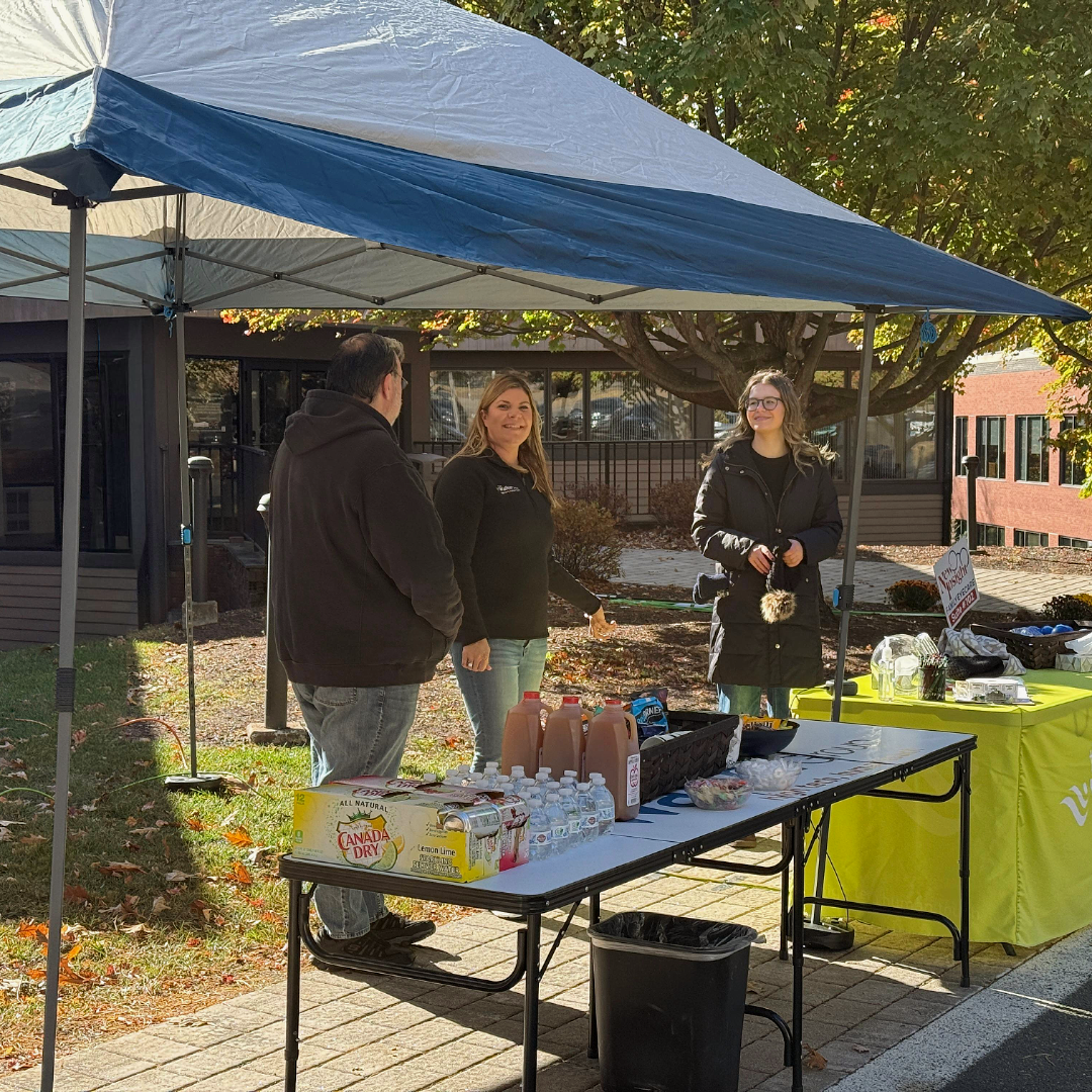 A cardboard box filled with old computer parts including a keyboard