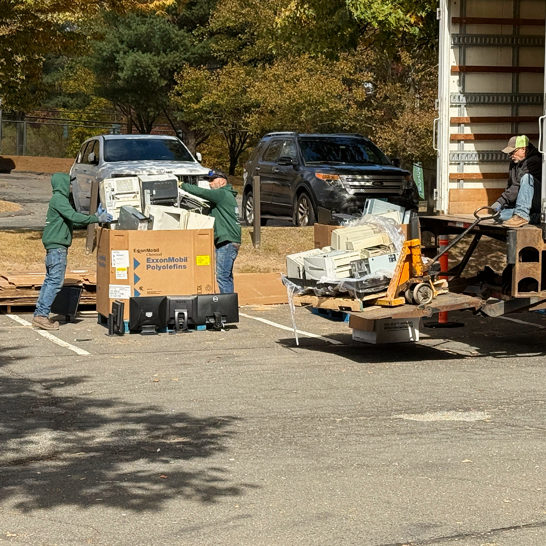 A bunch of electronic components are sitting on top of each other in a box that says plastic bottles