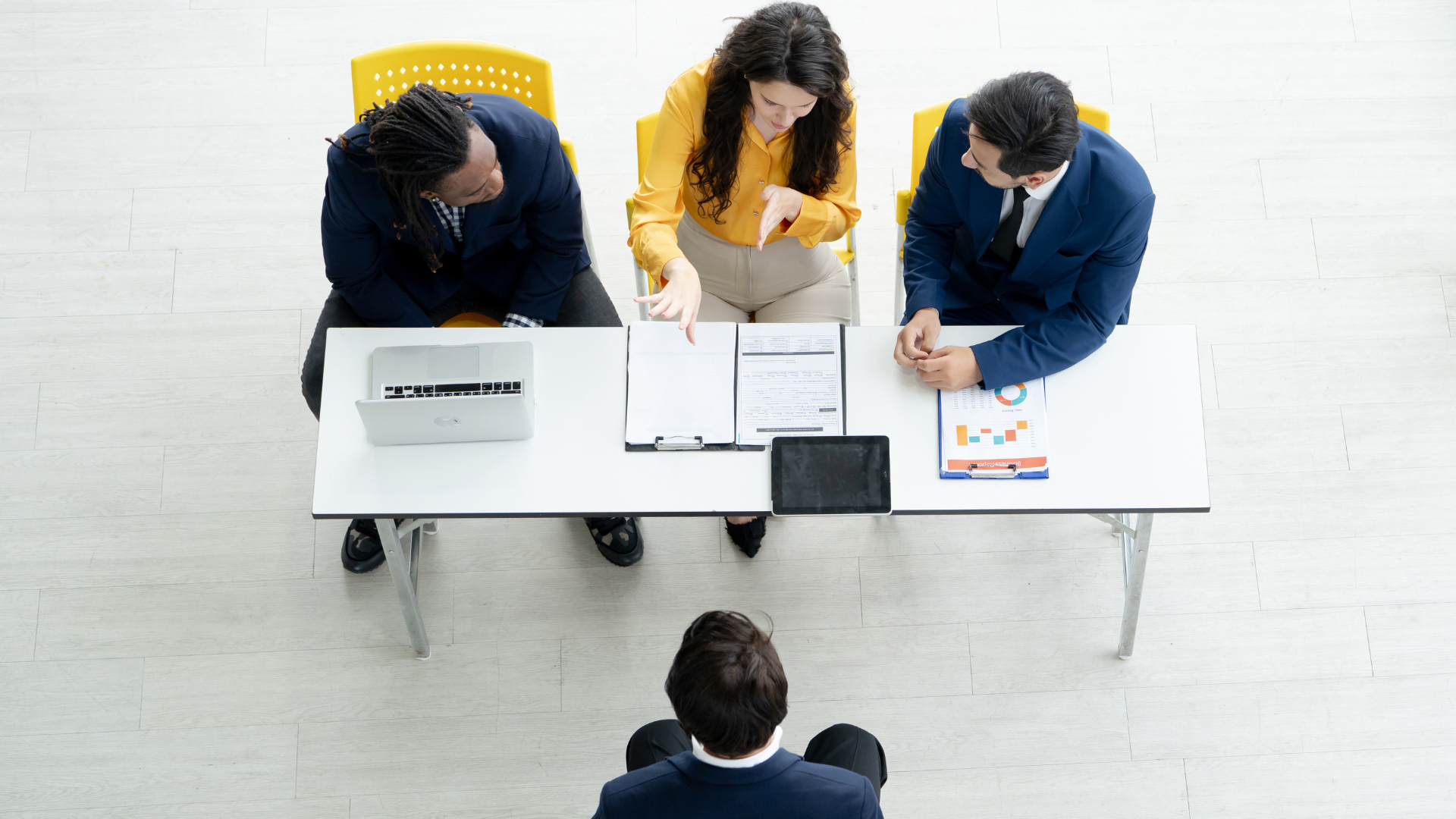 Professionals sitting at desk discussing project