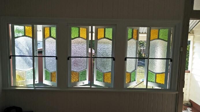 Three-pane Window With Stained Glass Panels in Yellow, Green, and Purple — Innisfail Glass & Aluminium in Innisfail, QLD