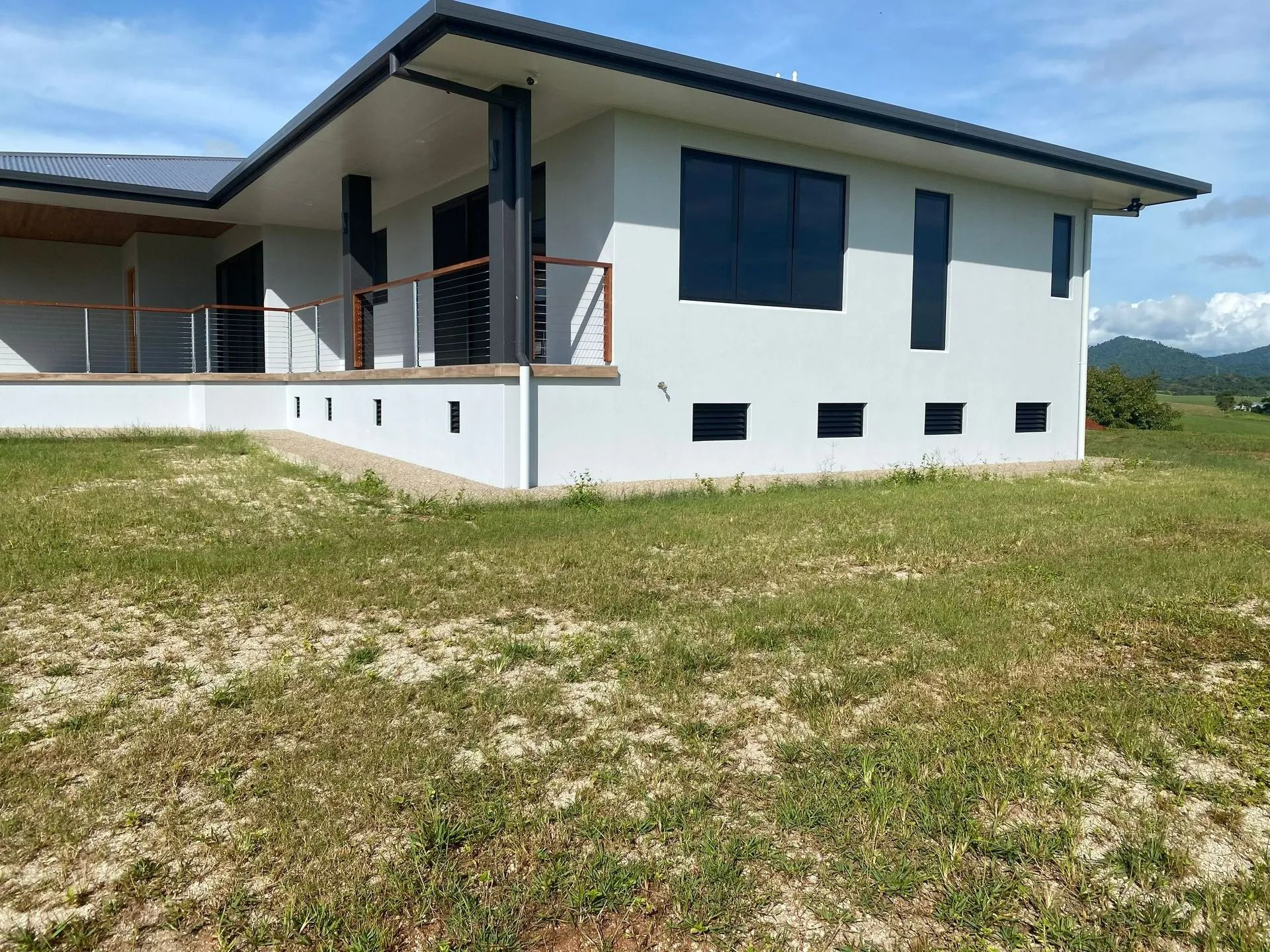 A Modern White House With Black Window Frames — Innisfail Glass & Aluminium in Innisfail, QLD