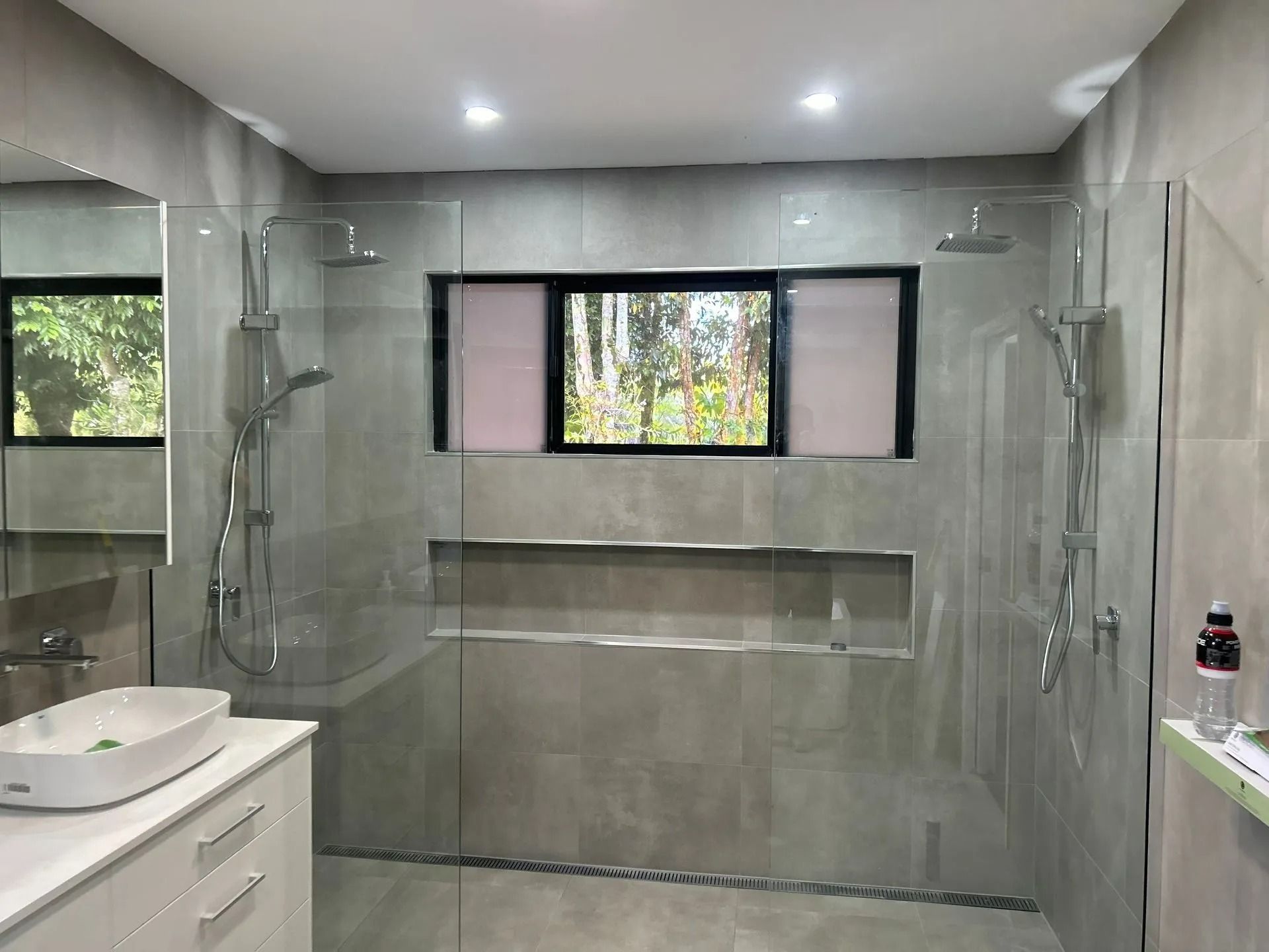 Modern Bathroom With Gray Tiled Walls — Innisfail Glass & Aluminium in Innisfail, QLD