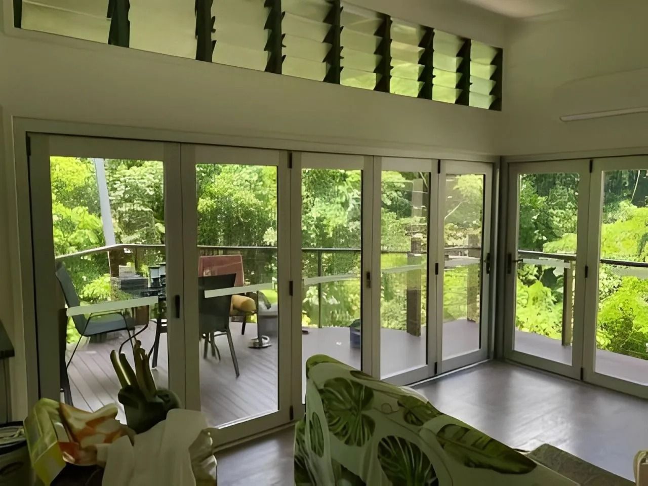 Living Room With Large Sliding Glass Doors — Innisfail Glass & Aluminium in Innisfail, QLD