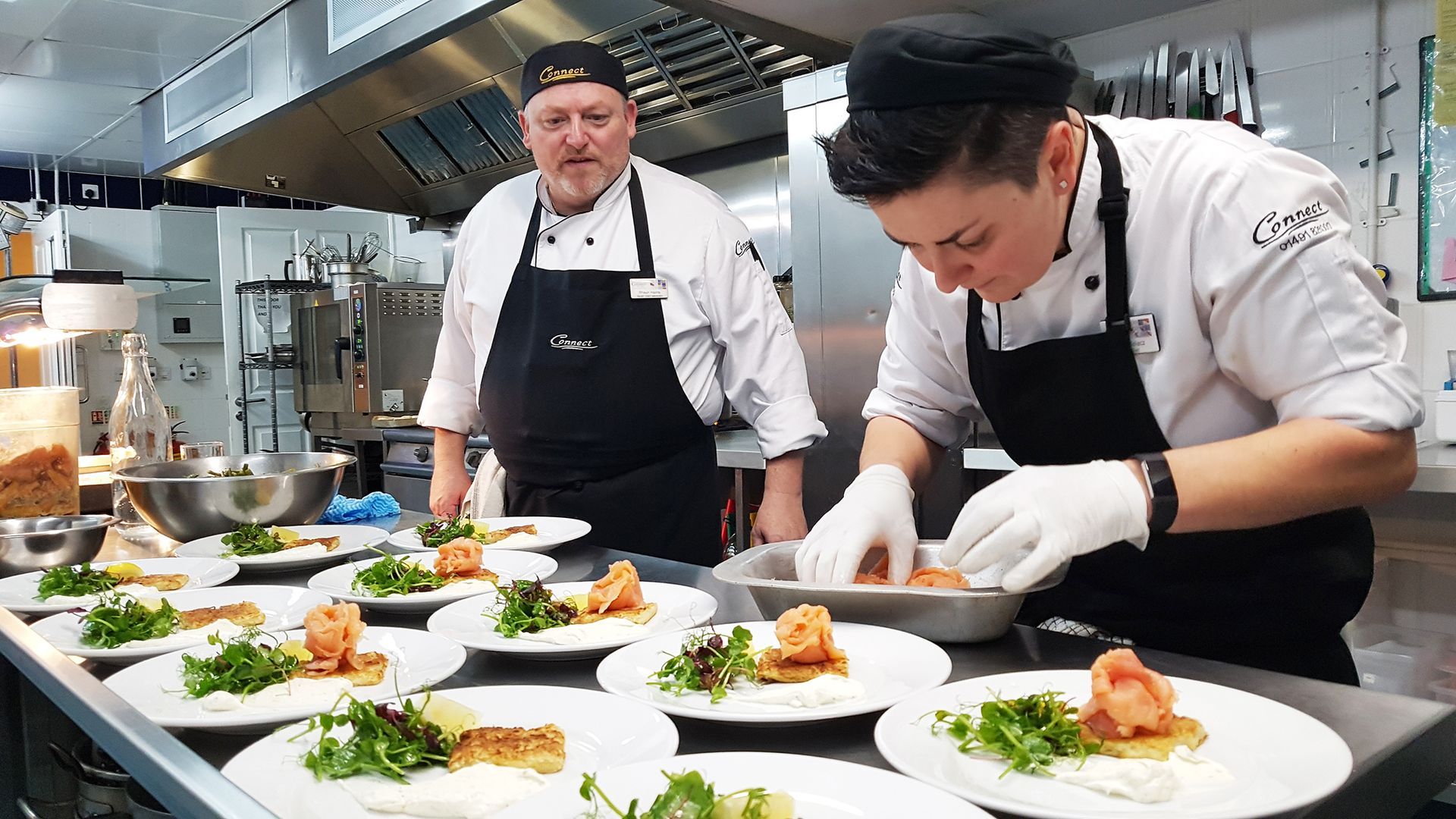 Contract Caterers plating up a fresh food dish