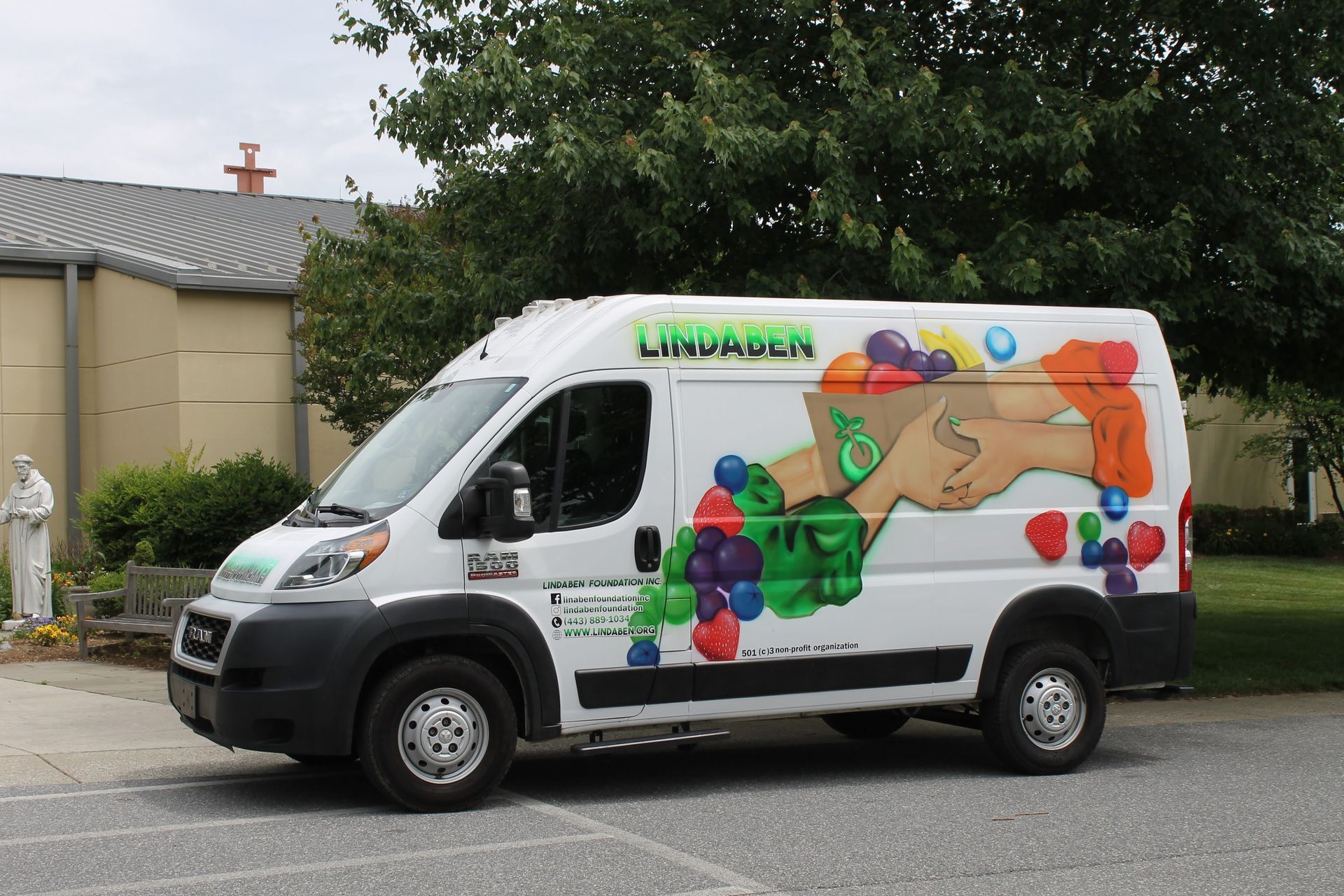 A white van with a picture of a handshake on it