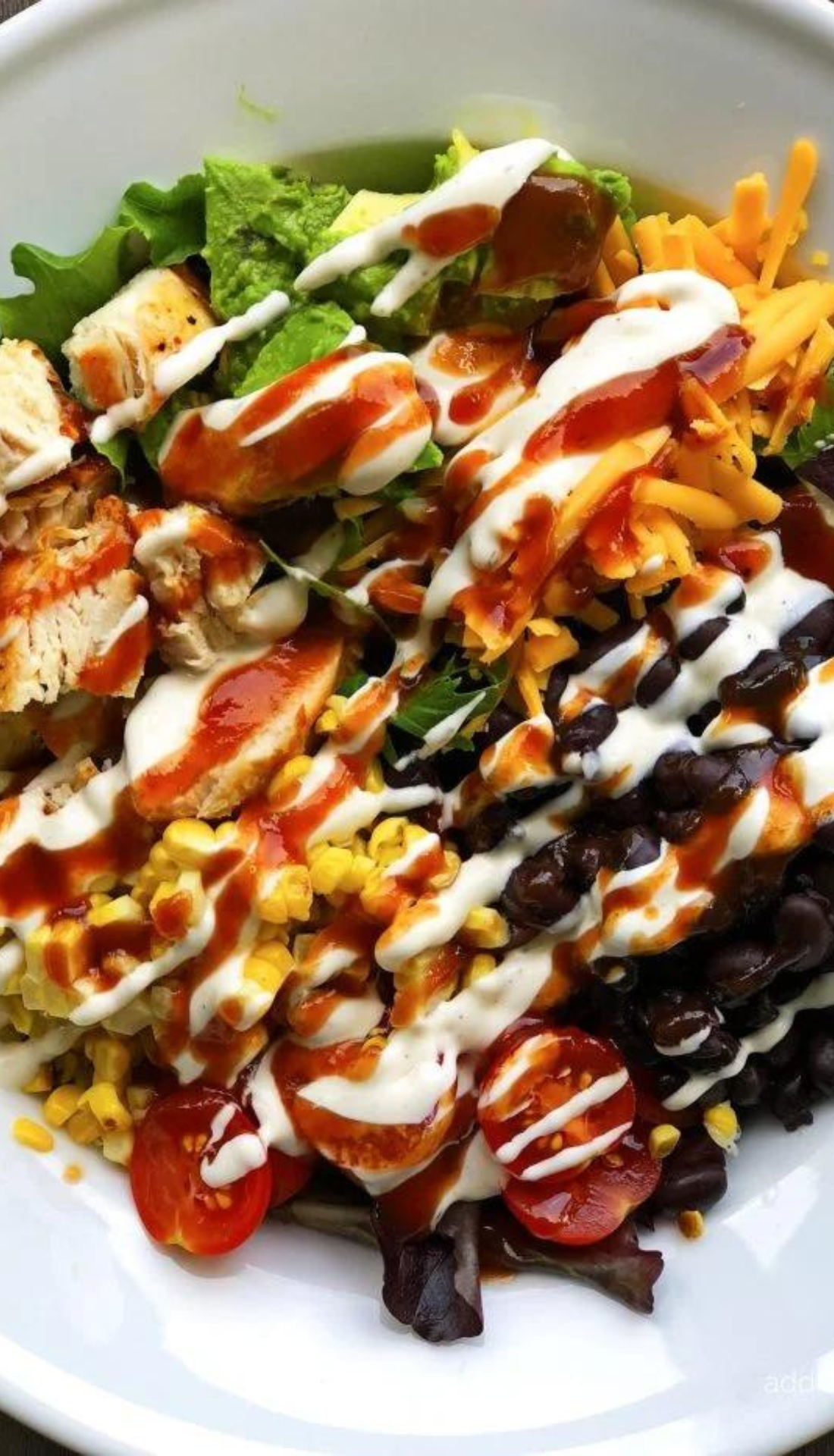 A close up of a salad on a white plate