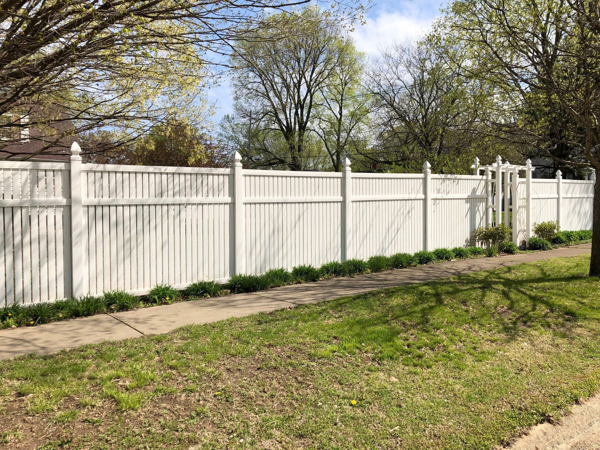 Backyard with a new light wood fence