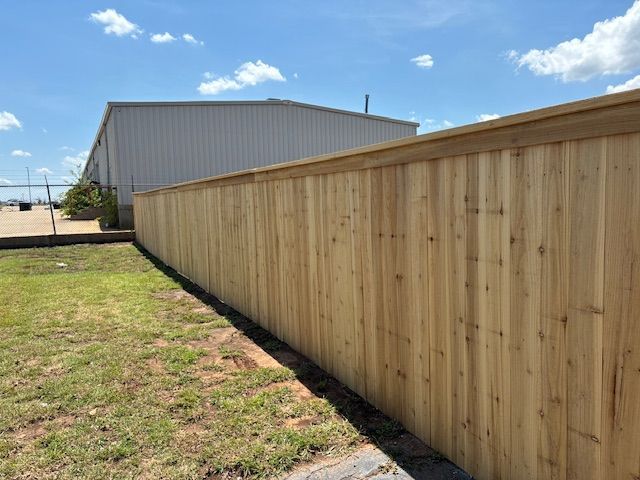 A nice front yard white picket fence by a fence contractor, an all-American white picket fence. A nice front yard cedar fence by a fence contractor, high quality materials
