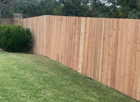 A nice front yard white picket fence by a fence contractor, an all-American white picket fence. A nice front yard cedar fence by a fence contractor, high quality materials