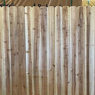 A close up of a wooden fence in a warehouse.