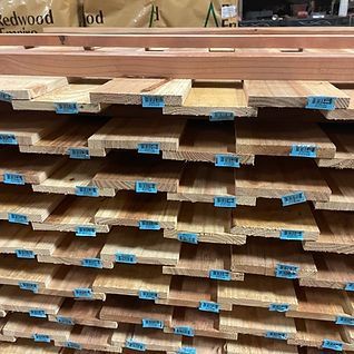 A bunch of wooden boards are stacked on top of each other