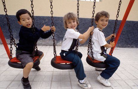 kids playing on the swing 