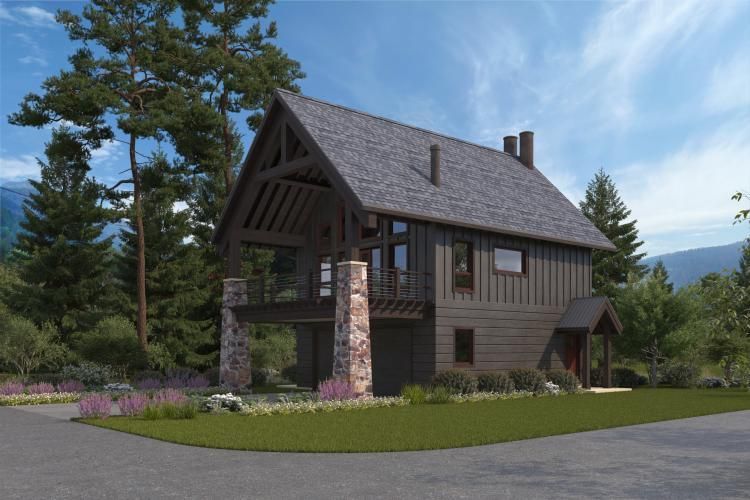 A rustic two-story timber-frame home with stone pillars and a wrap-around balcony in a wooded, mountainous setting.