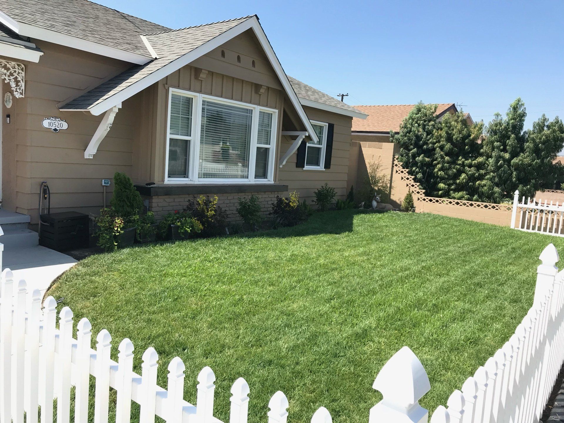 house with beautiful trimmed lawn in Garden Grove