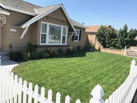 house with trimmed lawn in Orange County, CA