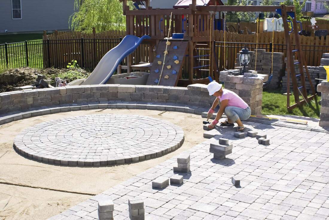 landscaper laying out concrete walkway in Orange County