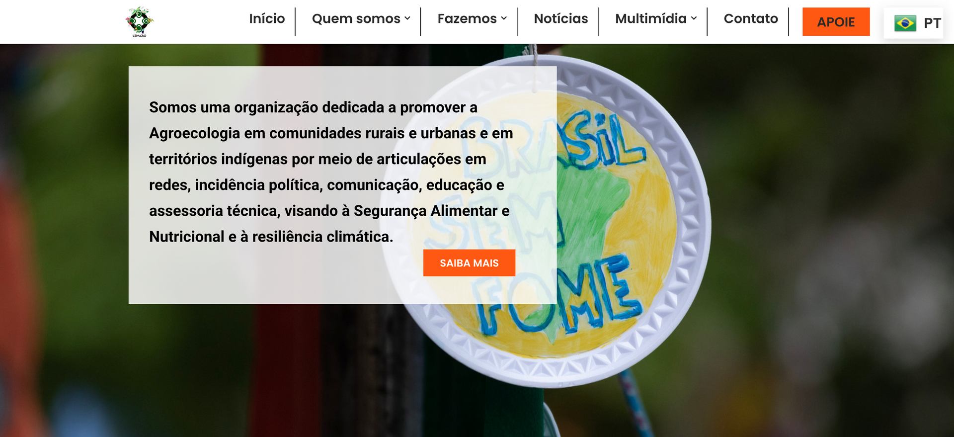 Text overlaying a sign with “Brasil S. Tome” on it, with an orange button that says
