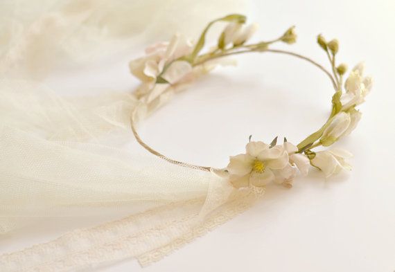 A flower crown is sitting on top of a white cloth.