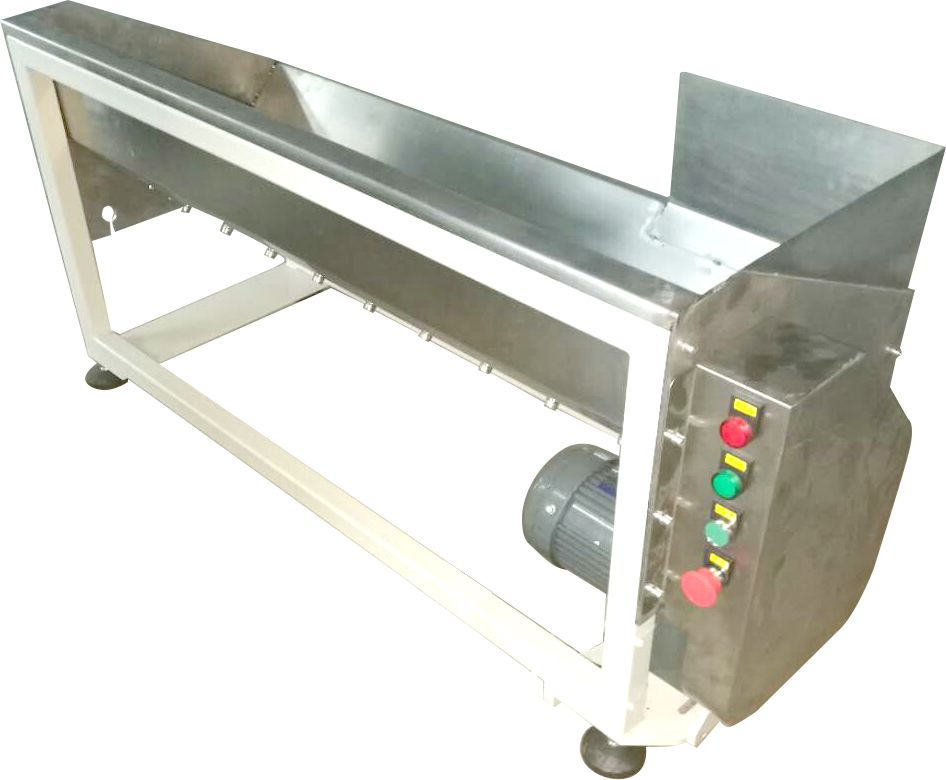 A stainless steel conveyor belt with a motor attached to it