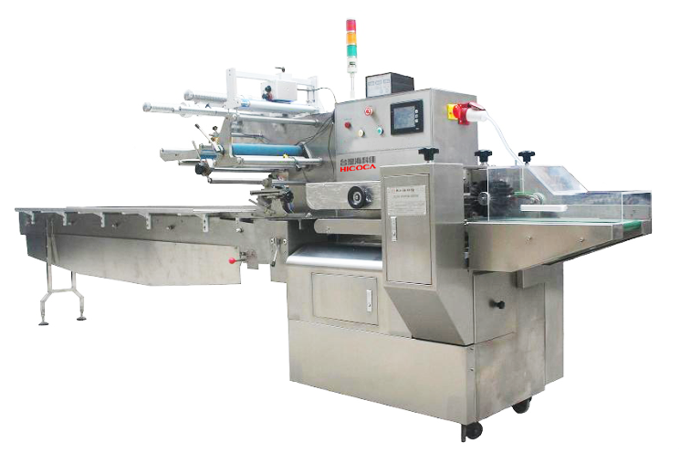 A stainless steel machine is sitting on a table on a white background.