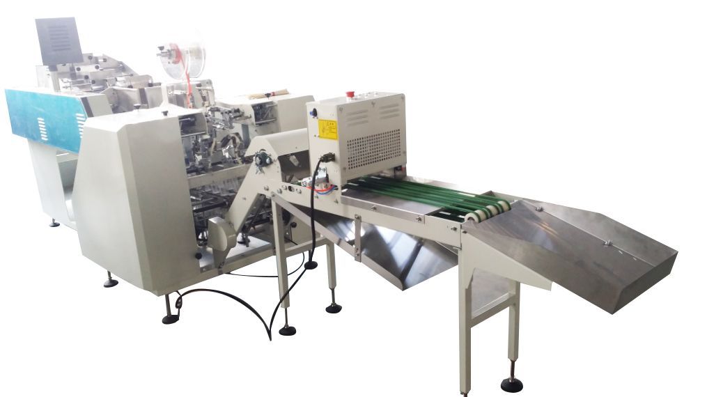 A machine is sitting on a conveyor belt on a white background.