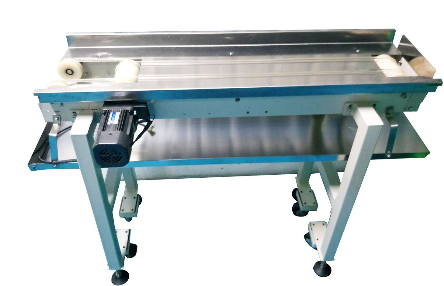 A conveyor belt with wheels and a motor on it