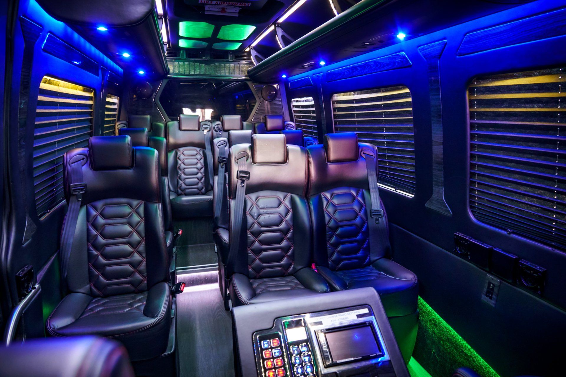 The inside of a van with lots of seats and blue lights. executive coaches premium chauffeur service memphis  tn