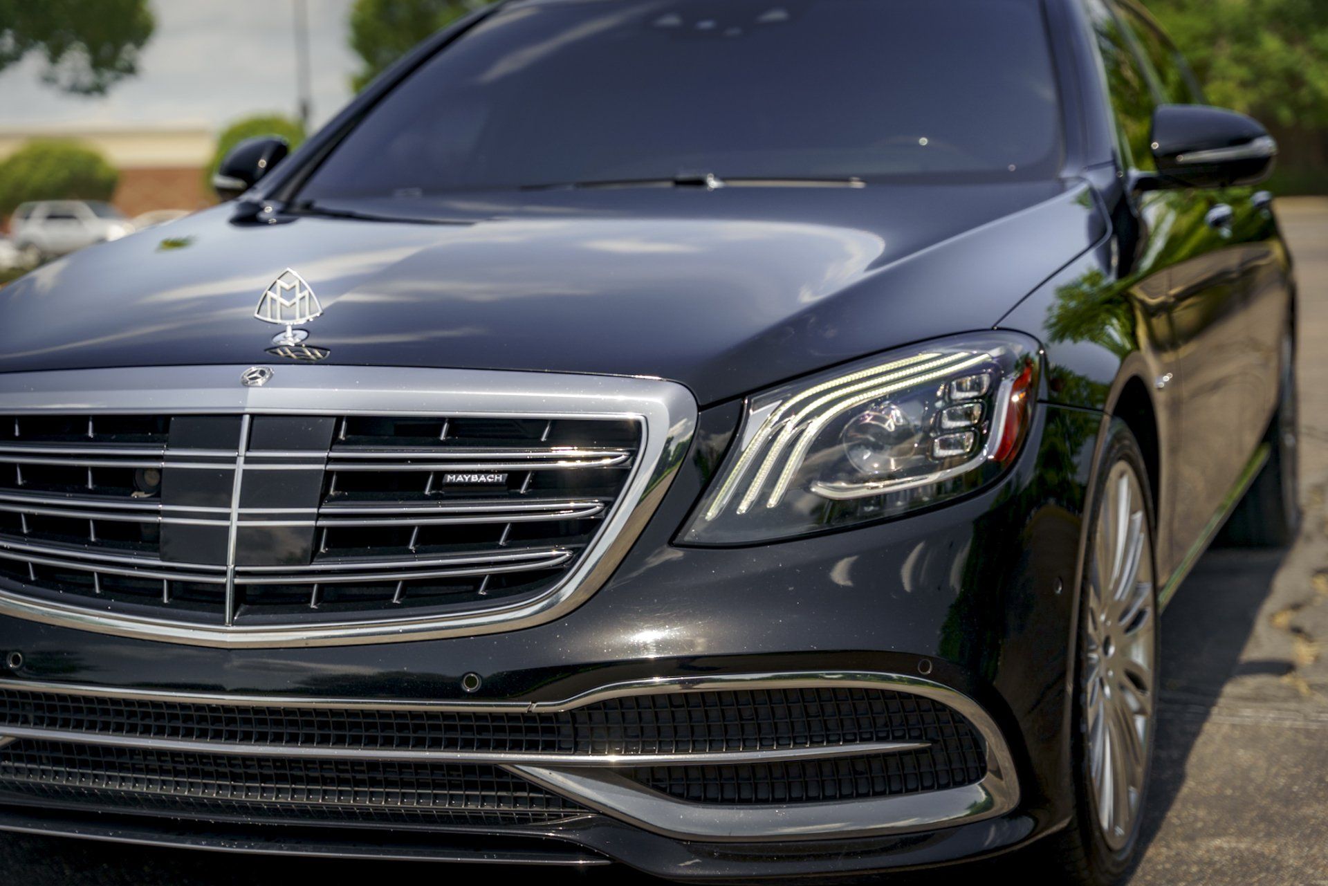 A black mercedes benz s class is parked on the side of the road. Executive Coaches Premium Chauffeur Service Memphis 