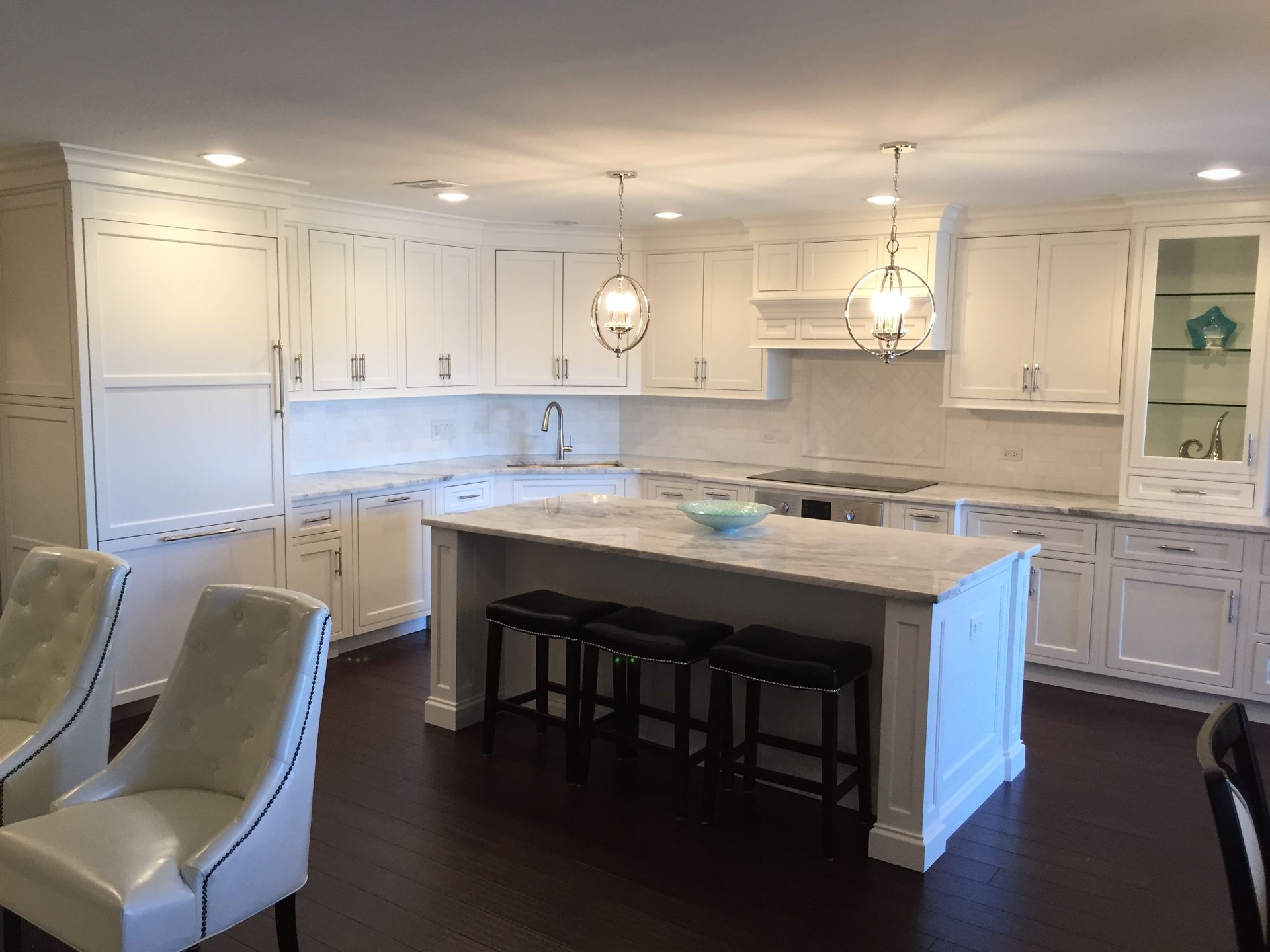There is a large island in the middle of the kitchen.