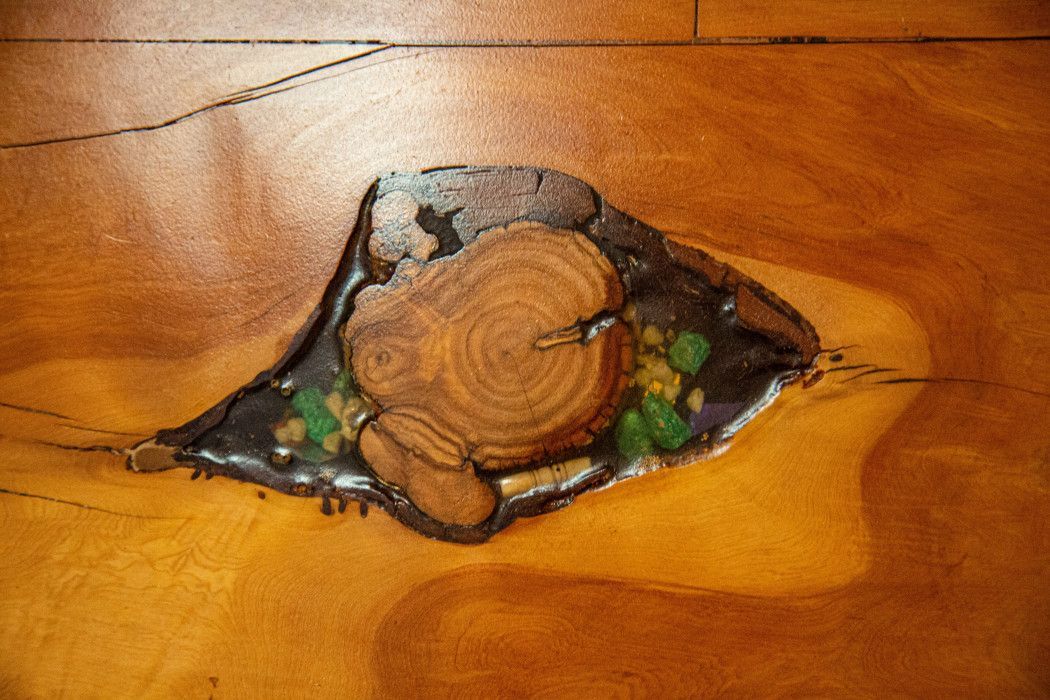 Close-up of a rustic piece of wood with a hole, showcasing natural texture at Southwest Inn Sedona