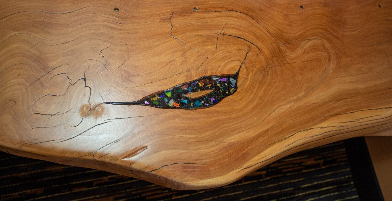 Close-up of a wooden piece with a hole, showcasing rustic details at Southwest Inn Sedona