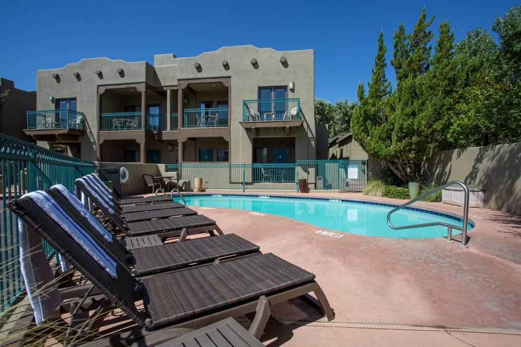 Large building with a swimming pool in front, near Southwest Inn Sedona
