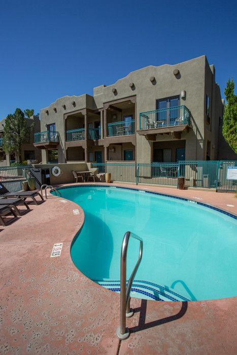 Large swimming pool in front of a building at Southwest Inn Sedona